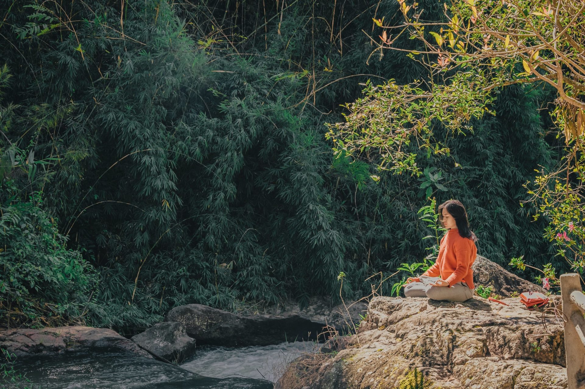 Mantra meditation by stream
